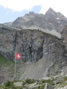 swiss flag in the mountains